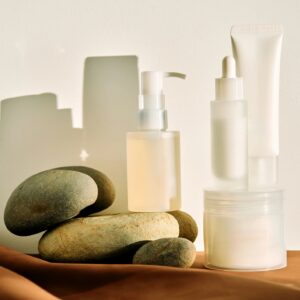 Skincare products with natural stones and shadows